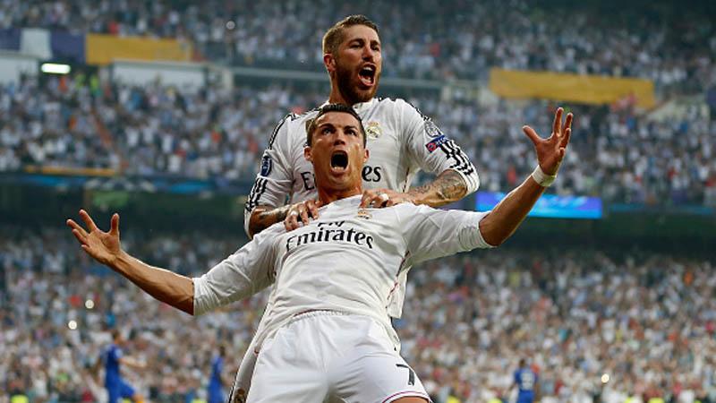 Cristiano Ronaldo dan Sergio Ramos berselebrasi. - INDOSPORT
